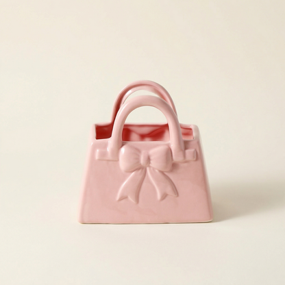 Vase céramique rose forme sac a main décor nœud